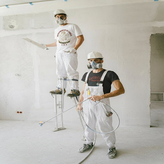 Two painters wearing t-shirts, entrepreneur by choice tradesmen by blood and American Painter t-shirt.